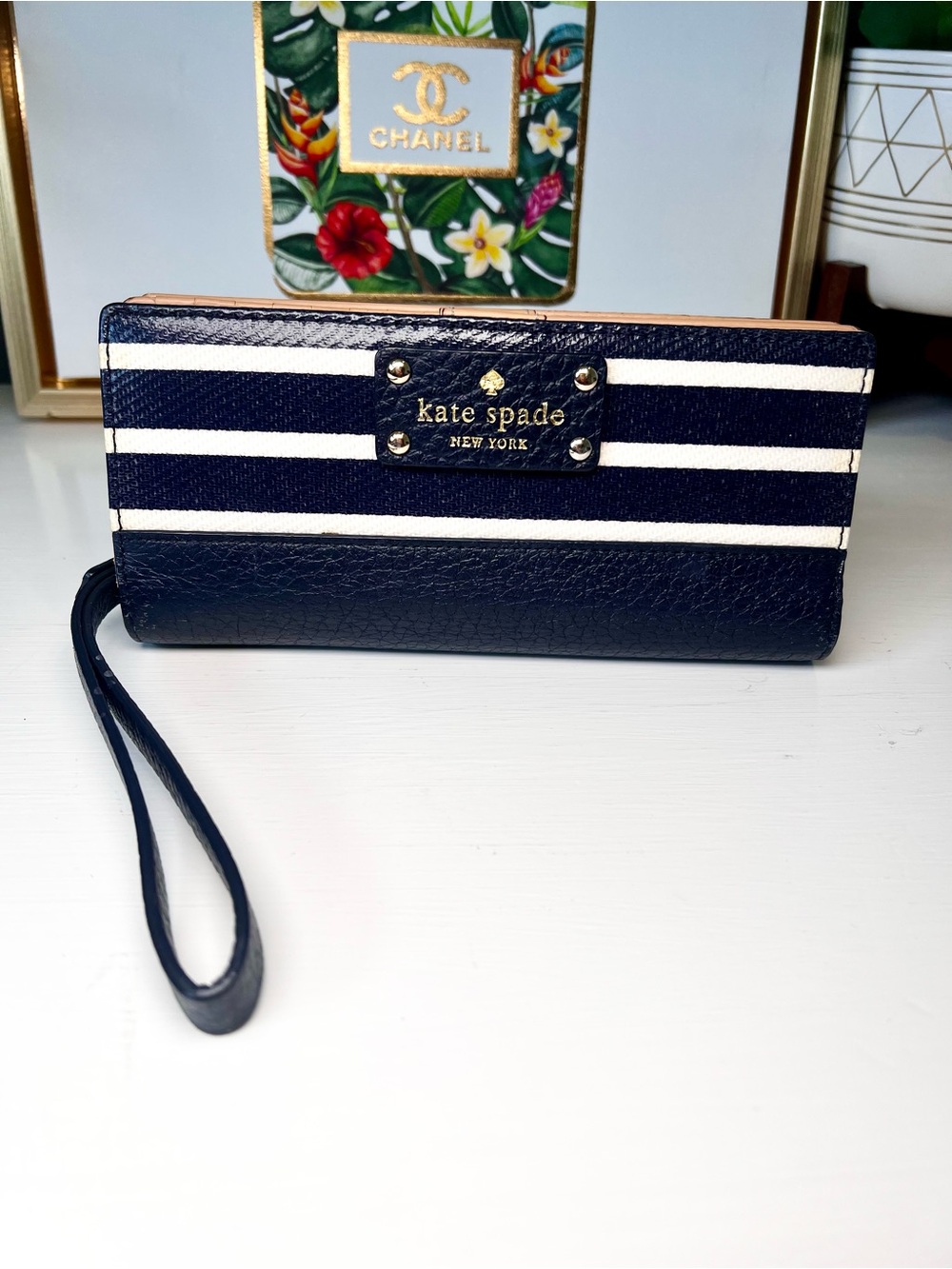 kate spade navy and white striped wristlet wallet with gold logo